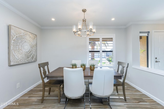 dining area with crown molding and hardwood / wood-style floors