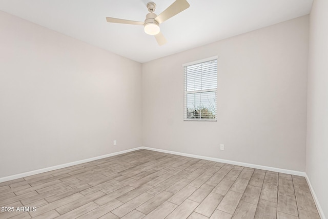 empty room with ceiling fan and light wood-type flooring