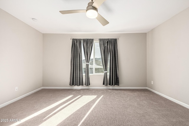 empty room with ceiling fan and carpet