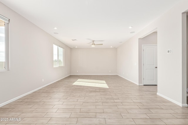 empty room featuring ceiling fan and light hardwood / wood-style flooring