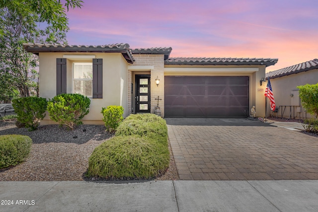 mediterranean / spanish-style house featuring a garage