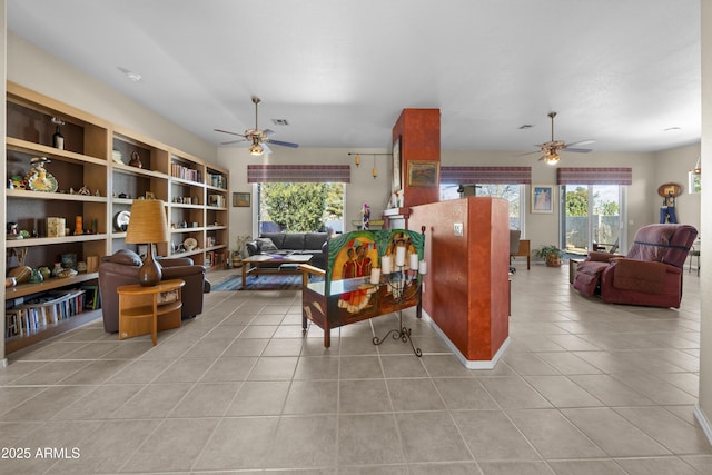 tiled living room with ceiling fan