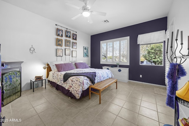 bedroom with light tile patterned floors and ceiling fan