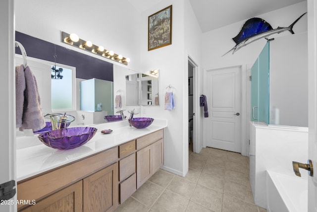 bathroom featuring vanity, independent shower and bath, and tile patterned flooring