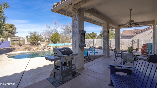 view of patio / terrace with ceiling fan, a grill, and a fenced in pool