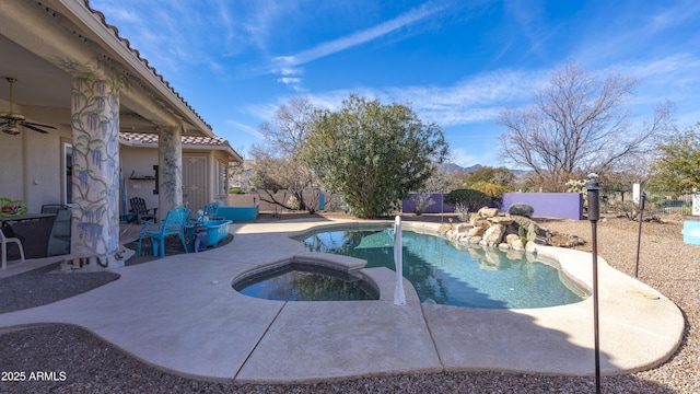 view of pool with an in ground hot tub and a patio