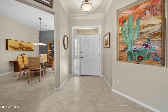 foyer entrance with light tile patterned floors