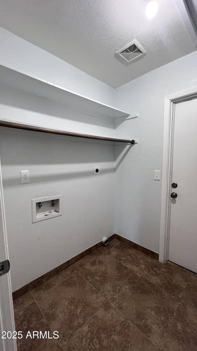 clothes washing area with hookup for a washing machine, baseboards, and electric dryer hookup