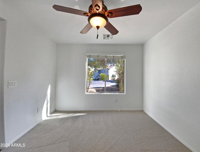 carpeted empty room with ceiling fan