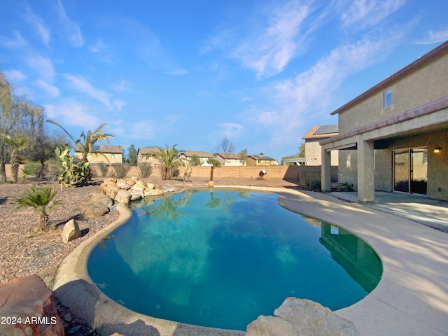 view of swimming pool featuring a patio area