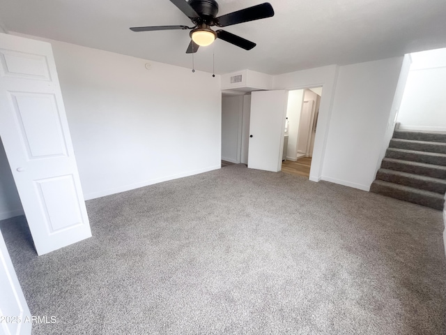 unfurnished bedroom with ceiling fan, carpet flooring, baseboards, and visible vents