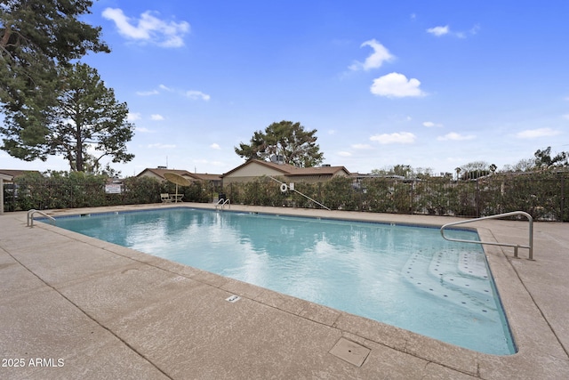 community pool with a patio area