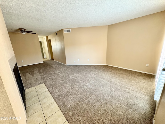 11640 N 51st Ave Unit 248, Glendale, AZ 85304 - unfurnished room with light colored carpet, a textured ceiling, visible vents, a fireplace, and a ceiling fan