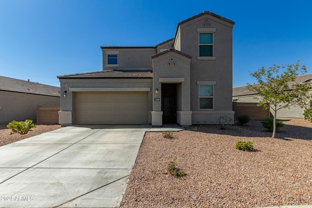 view of front of property with a garage