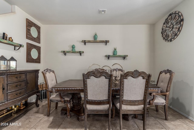 dining space featuring light tile patterned floors