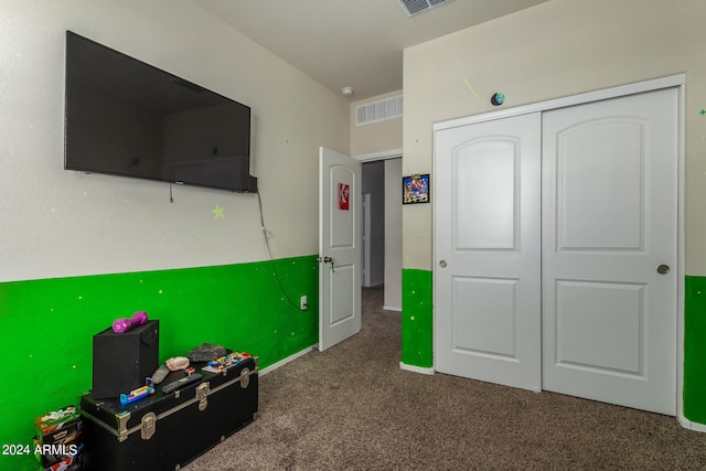 interior space with dark colored carpet