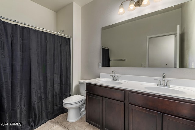 bathroom featuring vanity, toilet, a shower with shower curtain, and tile patterned floors