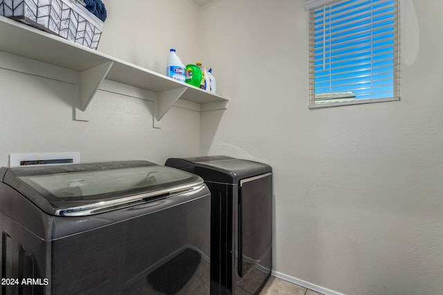 laundry area with washing machine and clothes dryer