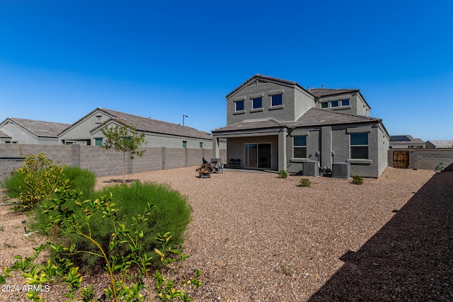 rear view of house featuring a patio and central air condition unit