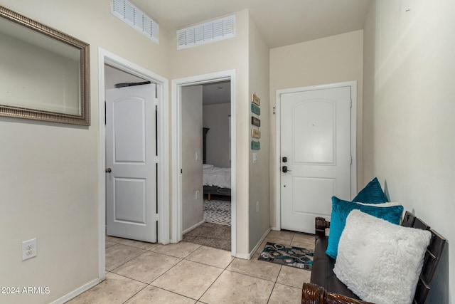 foyer featuring light tile patterned floors