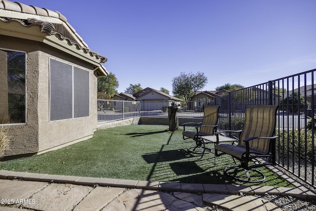 view of yard with fence and a residential view