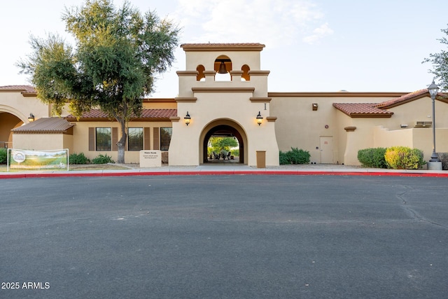 view of front of property featuring a tile roof and stucco siding