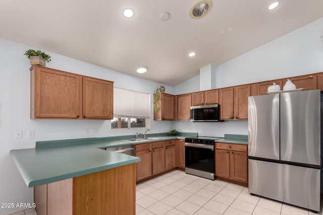 kitchen with kitchen peninsula, stainless steel appliances, light tile patterned flooring, lofted ceiling, and sink