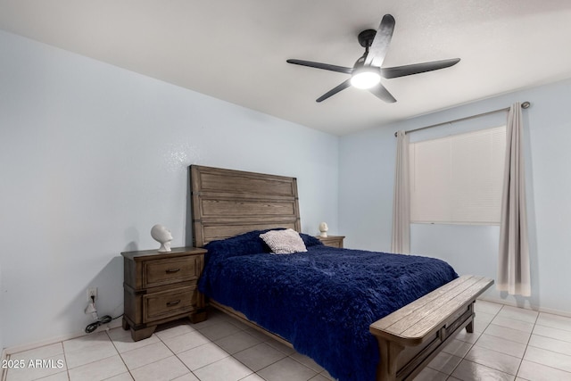 tiled bedroom featuring ceiling fan