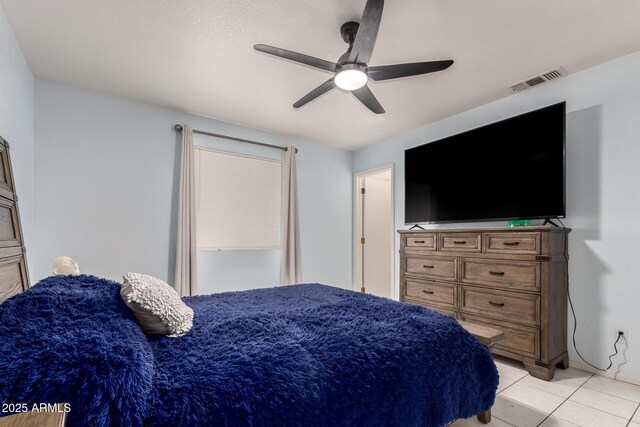 bedroom featuring ceiling fan and light tile patterned floors