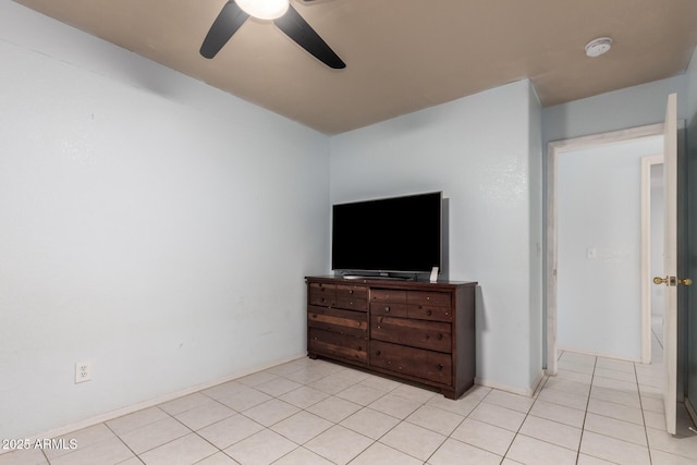 tiled bedroom featuring ceiling fan