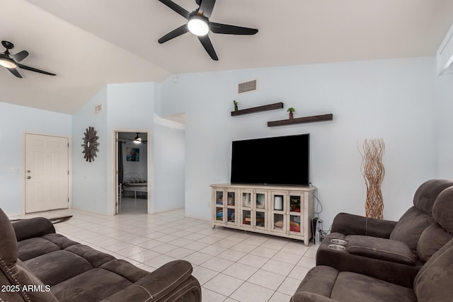 tiled living room with ceiling fan and vaulted ceiling