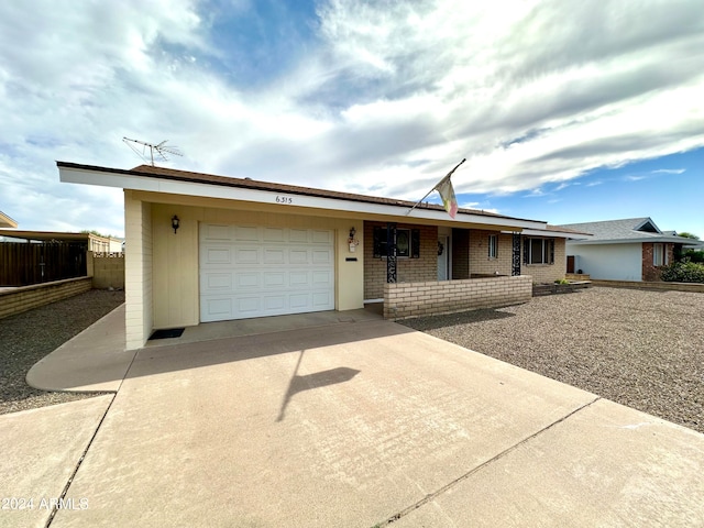 ranch-style house featuring a garage