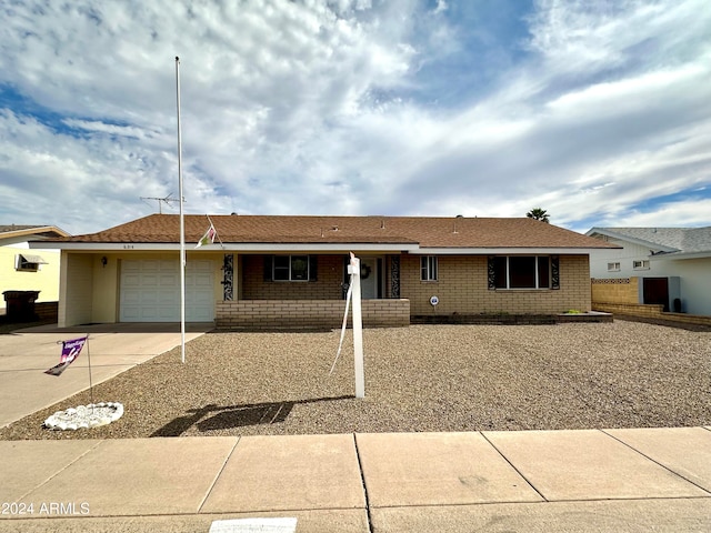 single story home featuring a garage