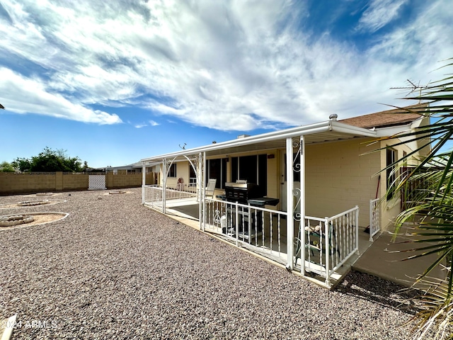 back of house featuring a patio area