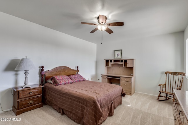 bedroom with ceiling fan and light carpet