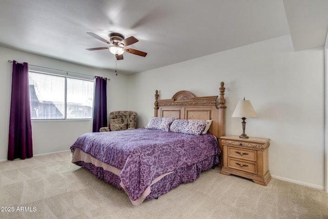 bedroom with ceiling fan and light carpet