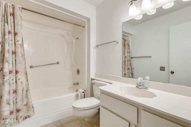 full bathroom featuring toilet, tile patterned flooring, vanity, and shower / bath combo with shower curtain