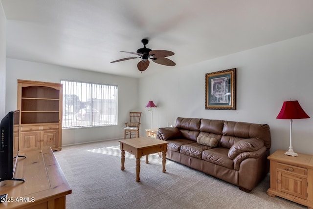 living room with ceiling fan and light colored carpet