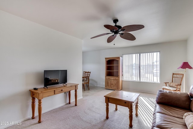 living room featuring ceiling fan and light carpet