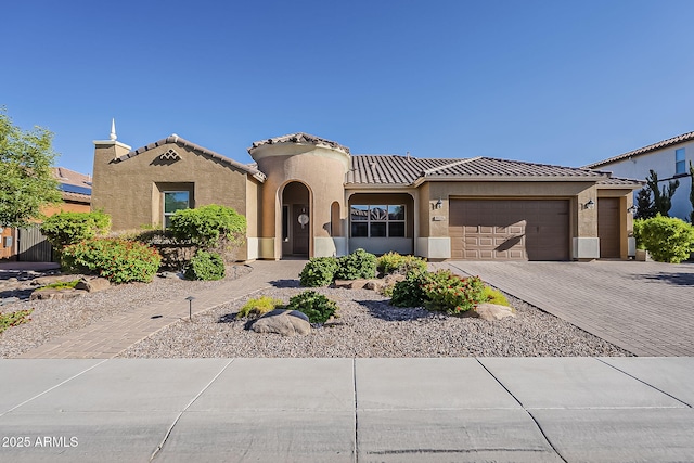 3925 E Elmwood St, Mesa, AZ 85205 - mediterranean / spanish-style house featuring a garage, a tile roof, driveway, and stucco siding