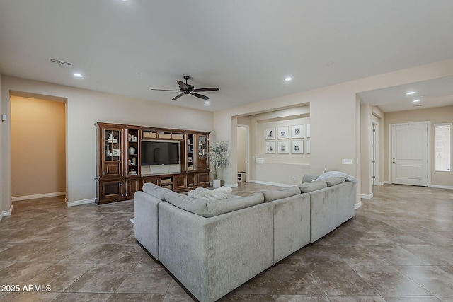 3925 E Elmwood St, Mesa, AZ 85205 - living room with a ceiling fan, recessed lighting, and stone finish flooring