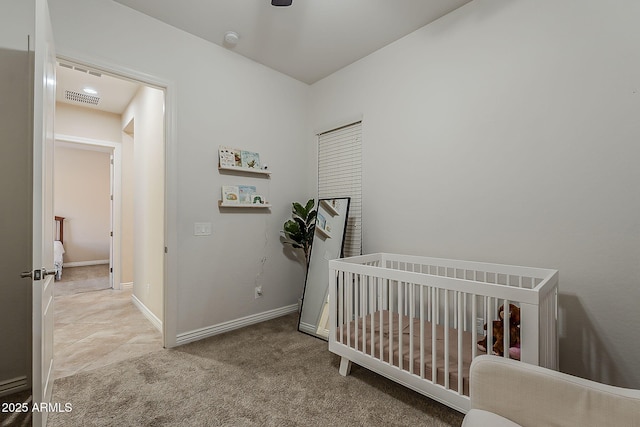 3925 E Elmwood St, Mesa, AZ 85205 - carpeted bedroom featuring a crib and baseboards