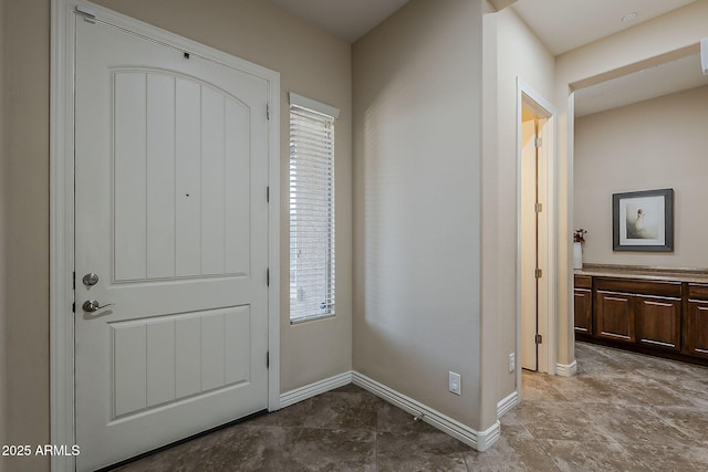 3925 E Elmwood St, Mesa, AZ 85205 - foyer entrance featuring baseboards and stone finish flooring