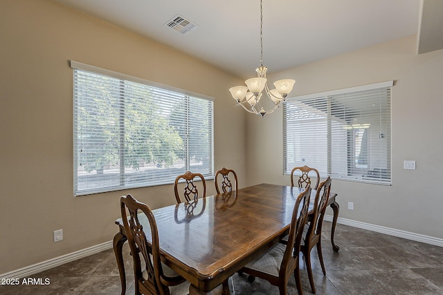 3925 E Elmwood St, Mesa, AZ 85205 - dining area with a chandelier and baseboards