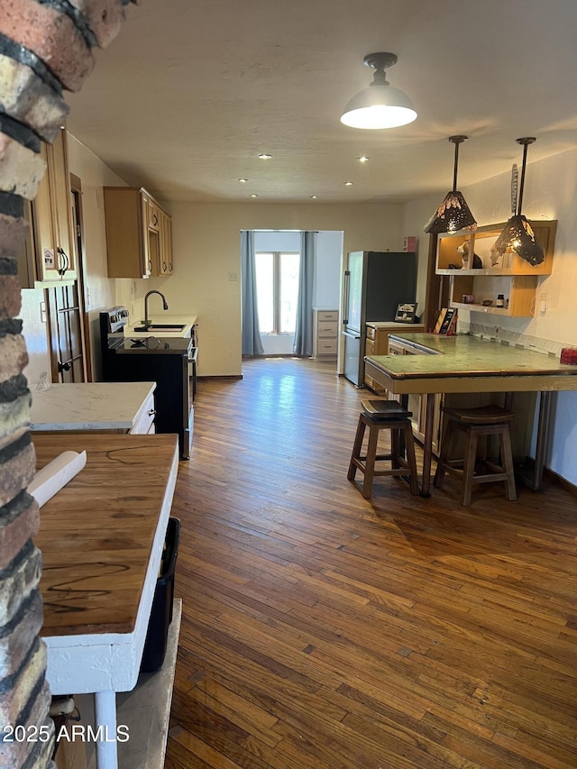 dining space with recessed lighting and dark wood-type flooring