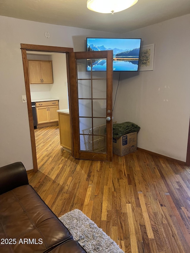 living room with wood finished floors and baseboards
