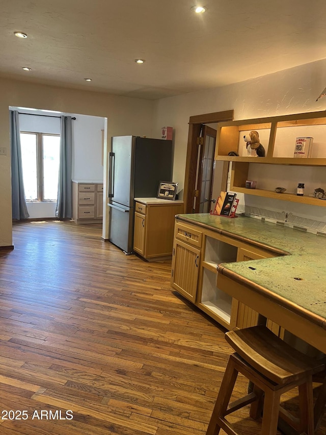 kitchen with dark wood-style floors, recessed lighting, and freestanding refrigerator