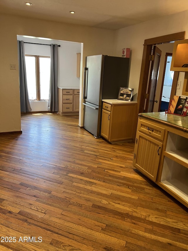 kitchen featuring dark wood-style floors, recessed lighting, and freestanding refrigerator