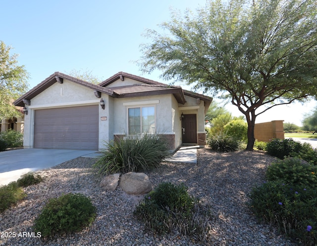 single story home with stucco siding, an attached garage, driveway, and a tile roof