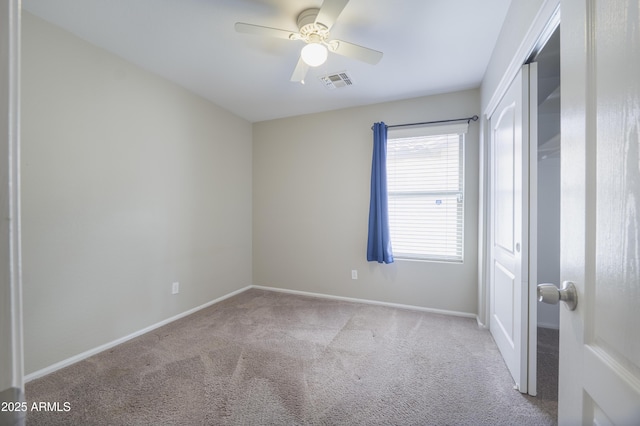 41388 W Hopper Dr, Maricopa, AZ 85138 - unfurnished bedroom featuring carpet floors, baseboards, and a ceiling fan